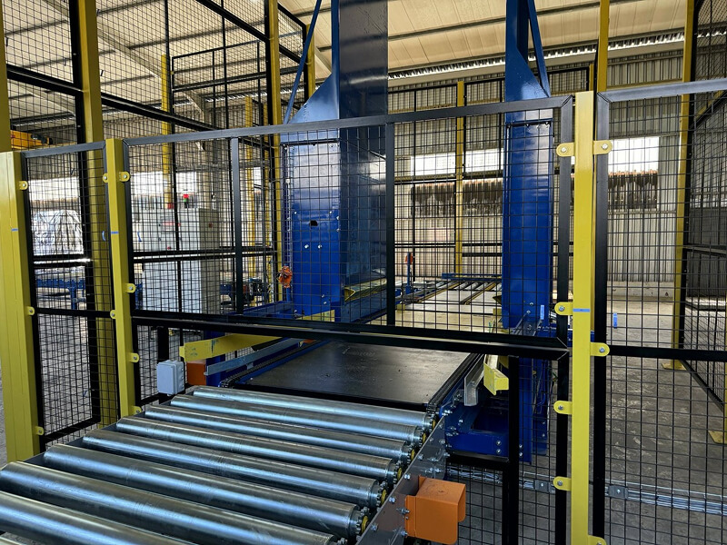Roller conveyor section and guarding on a Paterson Hughes pallet handling line, photographed during build